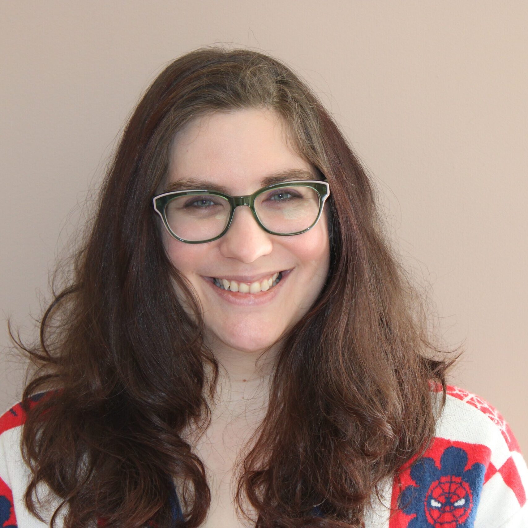 Female therapists. Brown hair and small cat eye shaped glassed.